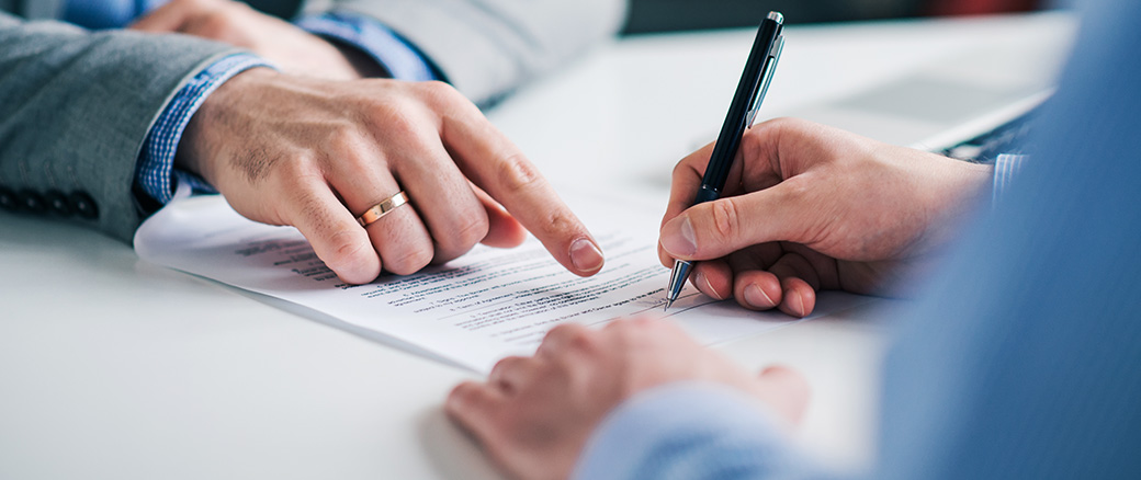Man signing documents